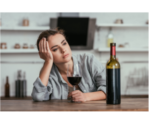 Person considering healthier habits by limiting alcohol intake for weight loss support with Flow Wellness