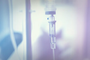 Close up IV saline solution drip for patient in hospital