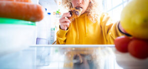 Banner of people taking food from fridge. Unhealthy food disorde
