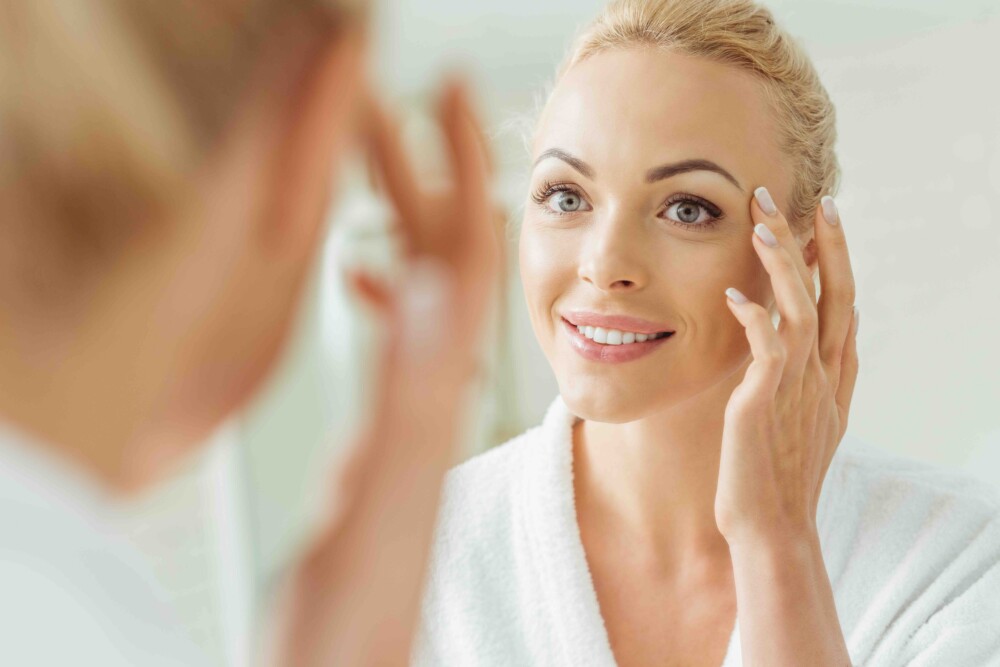 woman looking in mirror