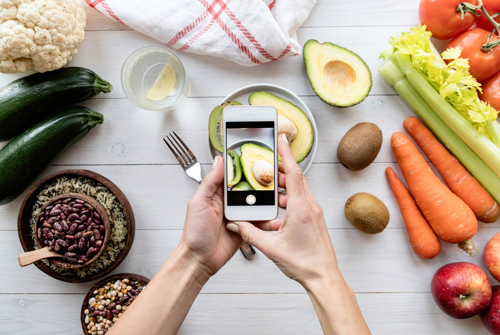 Tracking calories on phone apps.