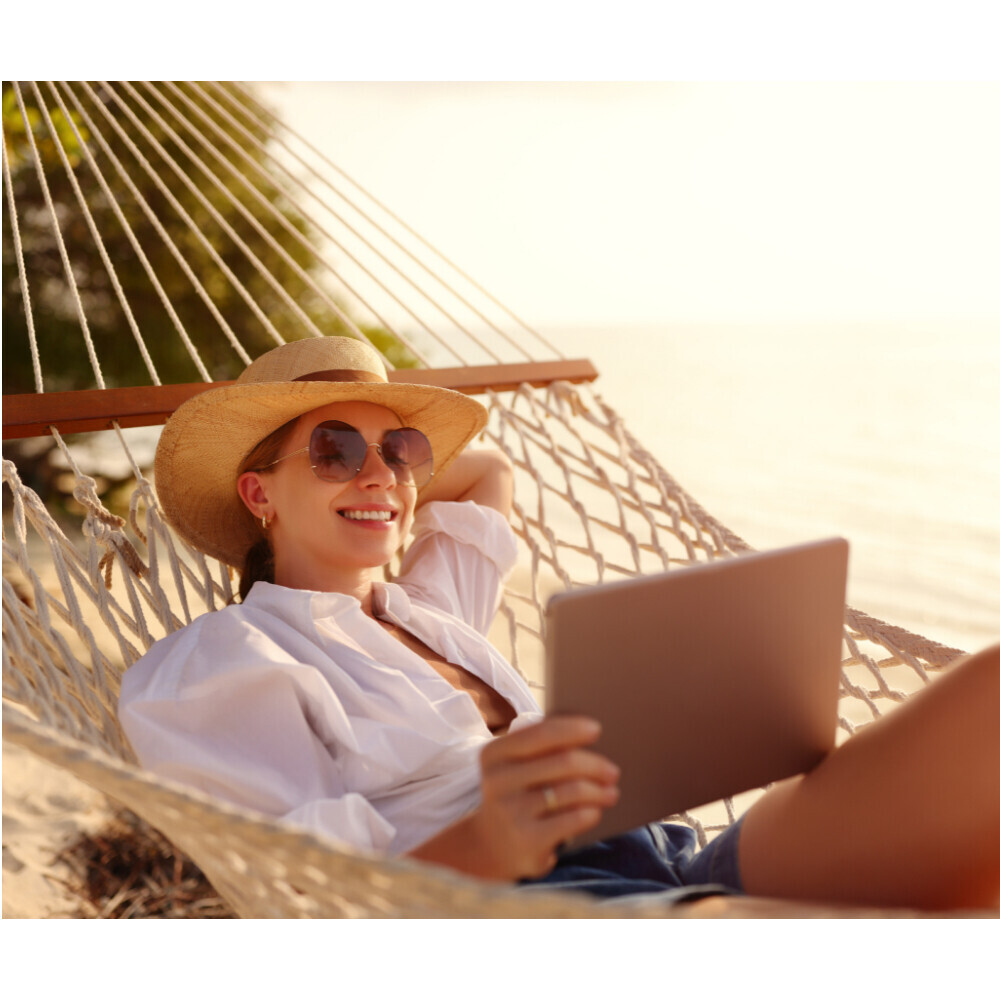 Woman relaxing in a hammock representing a custom-built IV blend at Flow Wellness