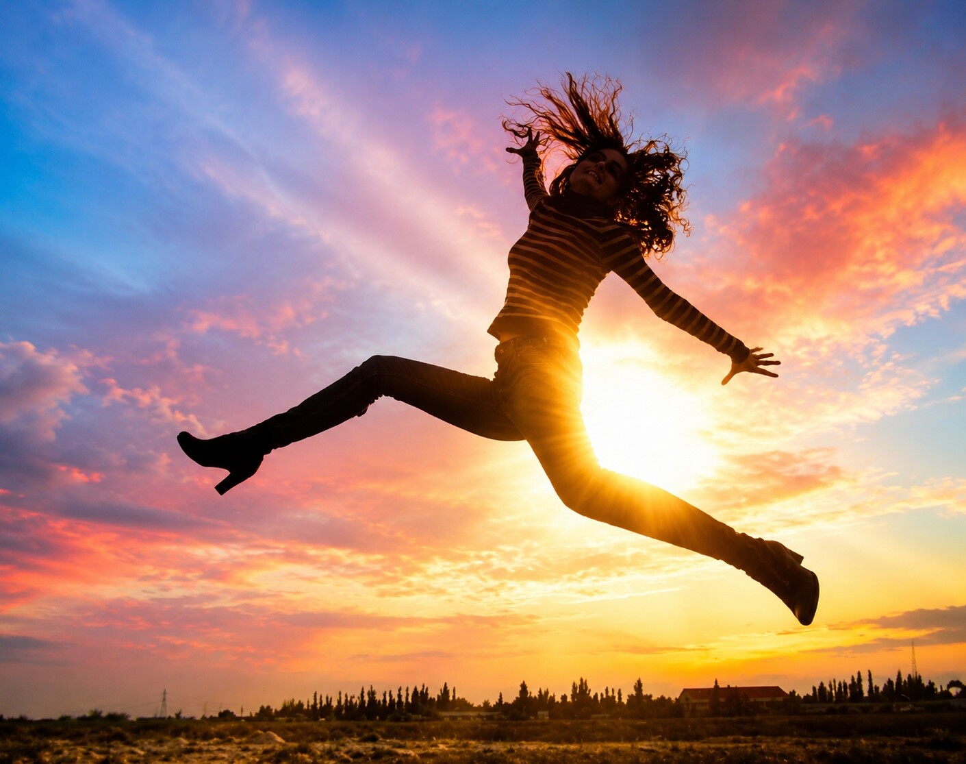 Woman enjoying a sunset representing renewed energy from the VitaShot injection at Flow Wellness